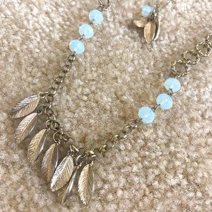long gold and blue feather necklace